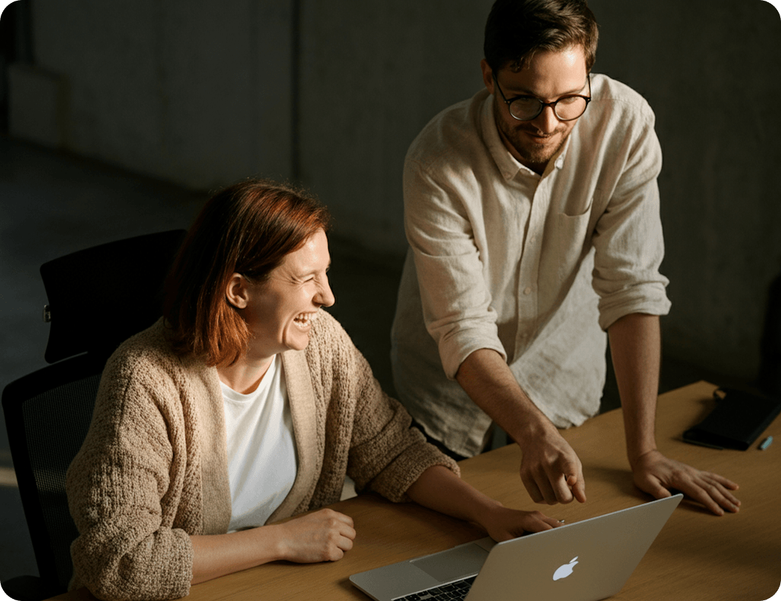 Advisor and client reviewing a plan at a laptop