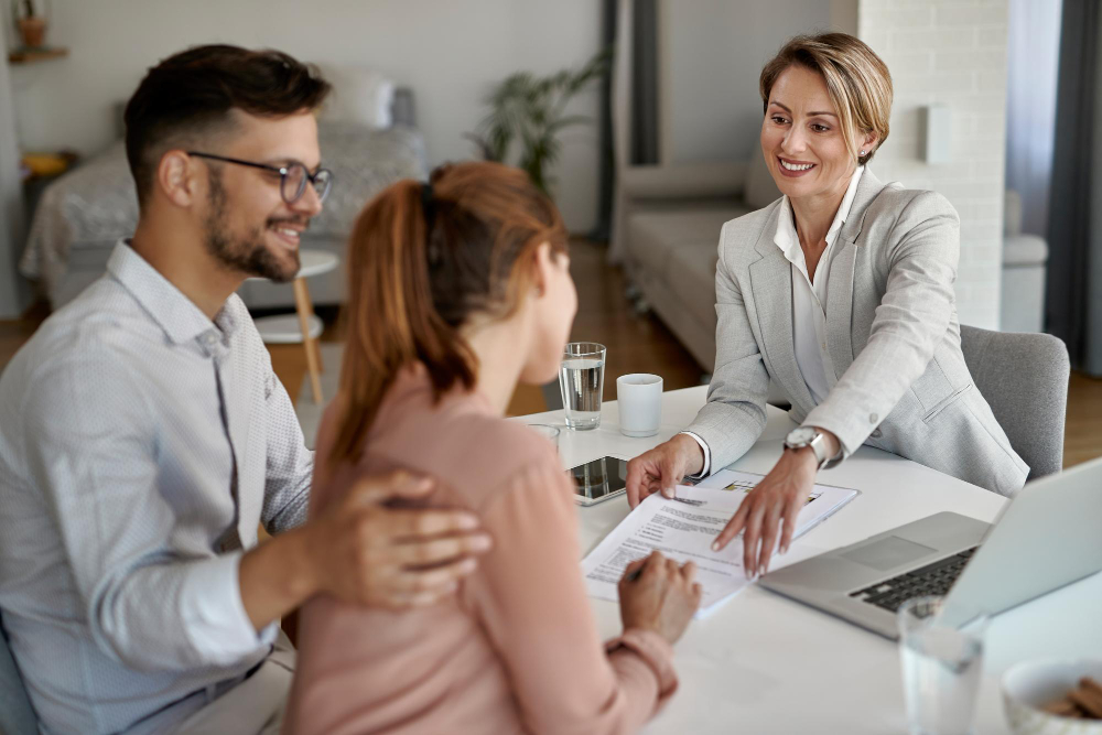 An advisor reviewing a plan with a couple at their kitchen table
